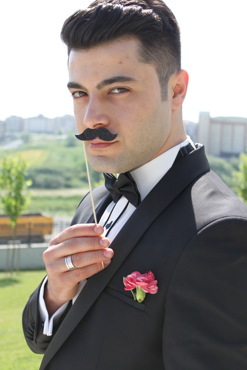 one Person, male, flowering plant, holding, adult, front view, green, day, plant, outdoors, son in law, elegance, mannequin, tuxedo, field, wedding, young Adult