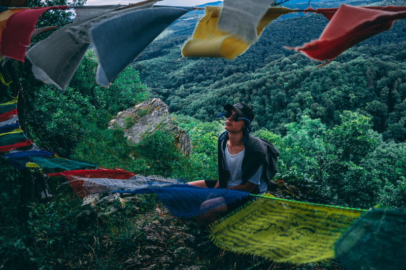 full length, adventure, land, colourful, casual clothing, adult, young adult, scenic, flags, hike, black, cap, daylight, hiking, fashion, mountain, outdoors