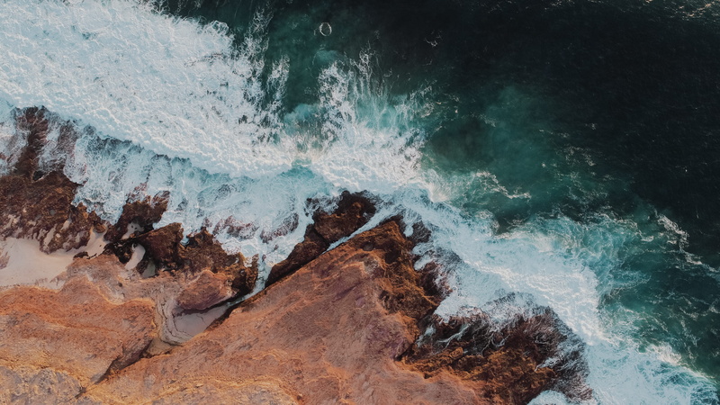 outdoors, from above, power, cliff, sea, aquatic sport, solid, beauty in nature, breaking, beside, rock - object, body, high angle view, nature, photo