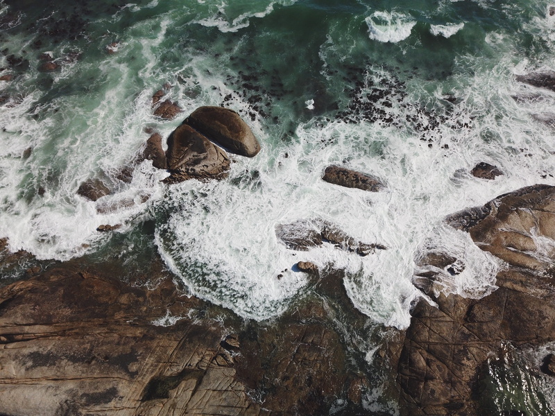 rock - object, rocky, water, land, from above, drone, view, nature, high angle view, motion, aerial view, flowing water, outdoors, body, ocean, sport, day