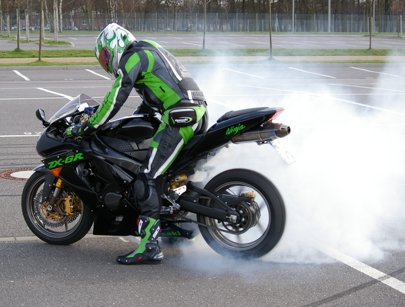 riding, speed, full length, zx, racing, one person, transportation, empty, outdoors, green, motion, ride, crash helmet, wearing, helmet, r, mode of transportation
