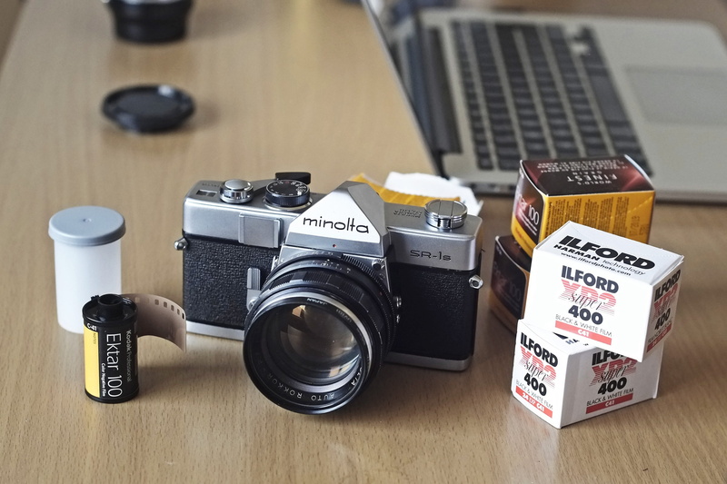 photographic equipment, indoors, shutter, wood - material, glass, antique, table, slr camera, focus on foreground, aperture, 35mm, photography themes, retro styled