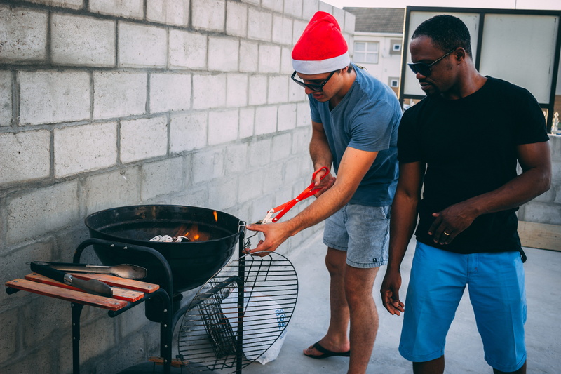 cap, three quarter length, household equipment, food, people, women, togetherness, lifestyles, preparing food, two, mid adult men, adult, man, standing