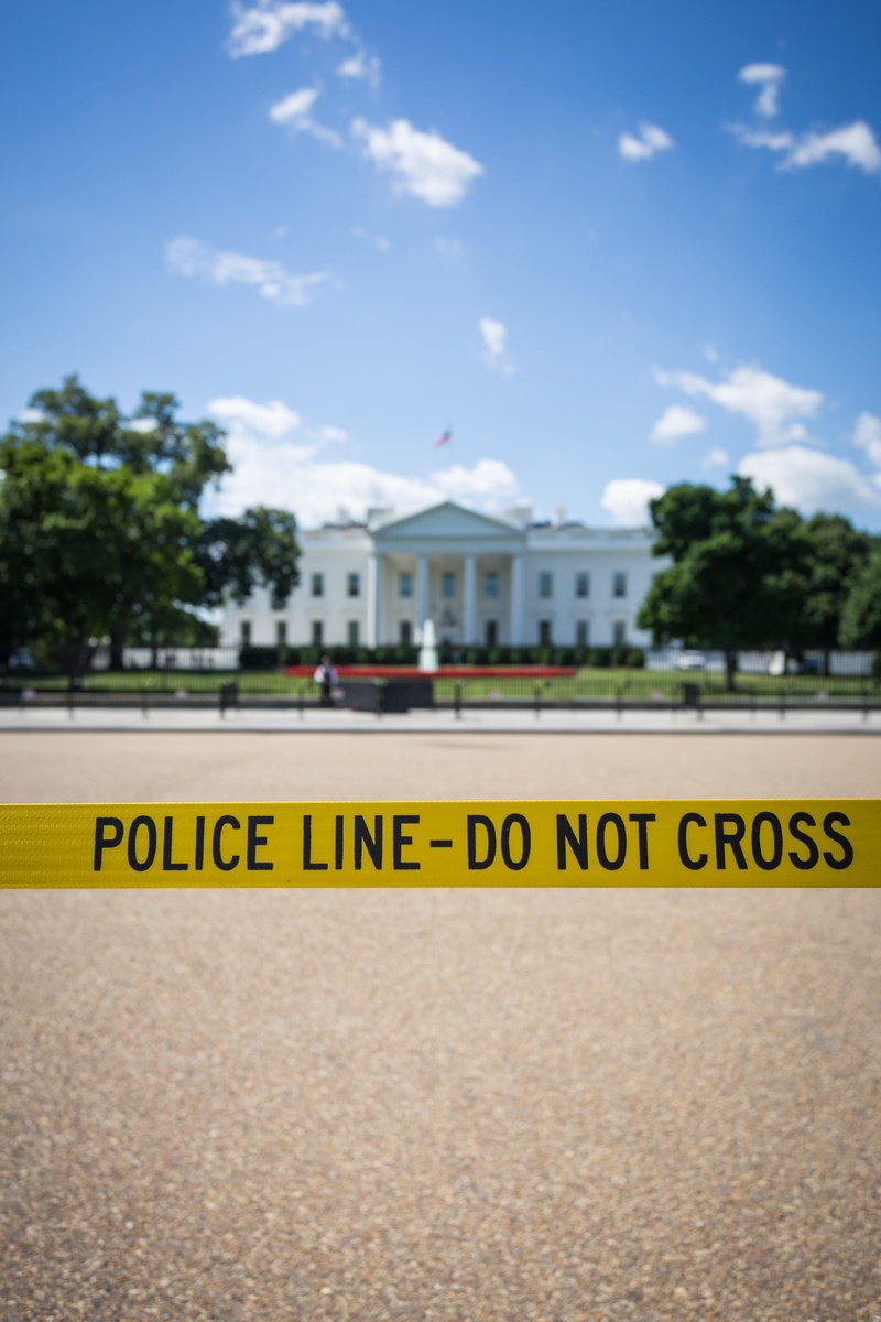 crime, building exterior, sky, white, warning, government, daytime, barrier, security, white house, text, cloud - sky, architecture, protection, line, nature