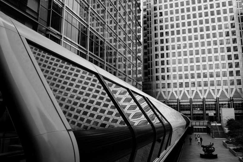 bridge, outdoors, walking, architecture, office building exterior, greyscale, modern, infront, photography, near, glass, people, office, mode of transportation