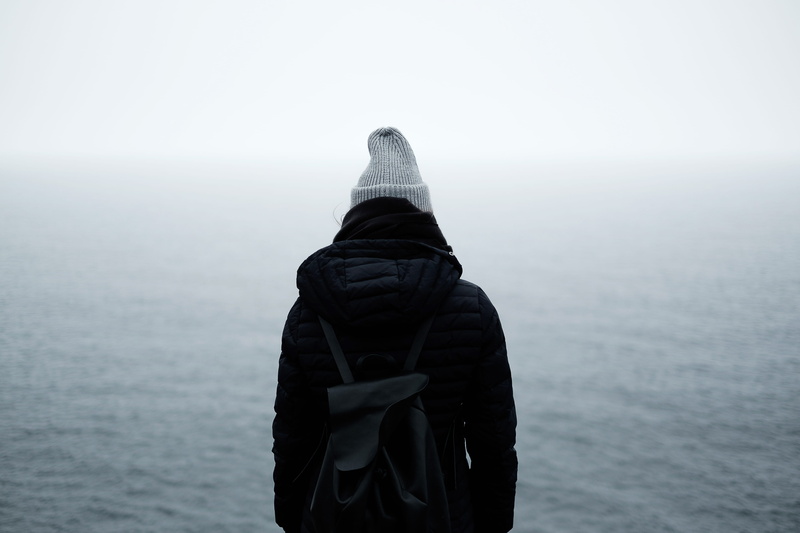 standing, one person, back, ocean, outdoors, nature, black, scenics - nature, clothing, quiet, hood, day, backpack, hood - clothing, trip, sea, body, warm clothing