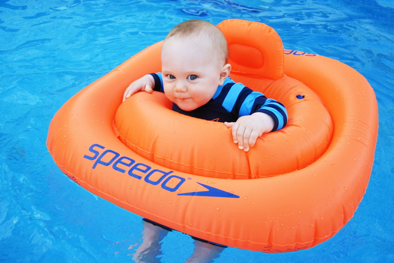 looking at camera, 4K, floater, water, baby, outdoors, childhood, Cute, boy, high angle view, innocence, swimming pool, people, Pool, safety, fun, blue
