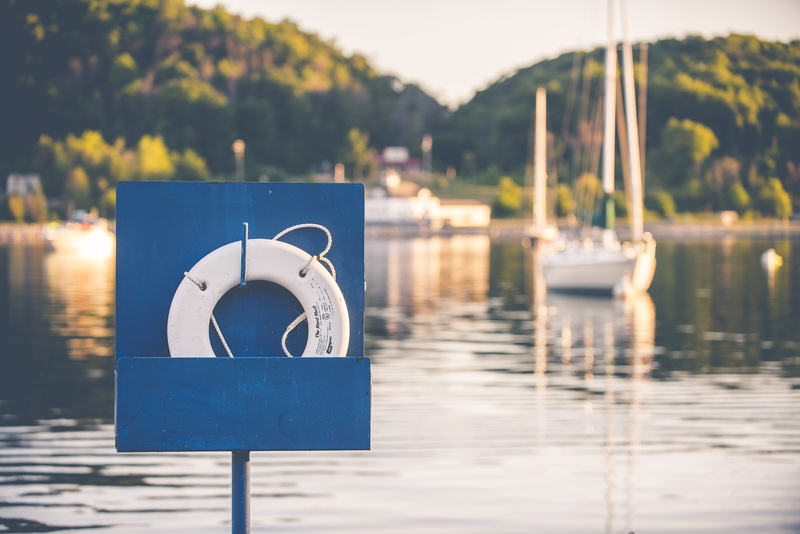 selective focus, photography, on hook, ring, communication, lake, sea, far, pier, transportation, body, sign, harbor, away, day, life preserver, boat, near