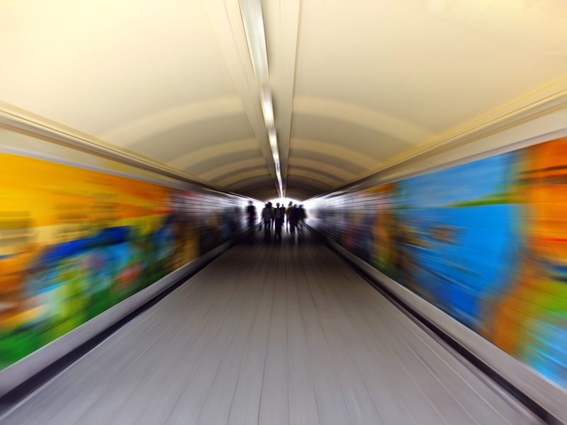 tunnel, light, flooring, blur, mode of transportation, person, station, motion, public transportation, speed, transportation, illuminated, diminishing perspective