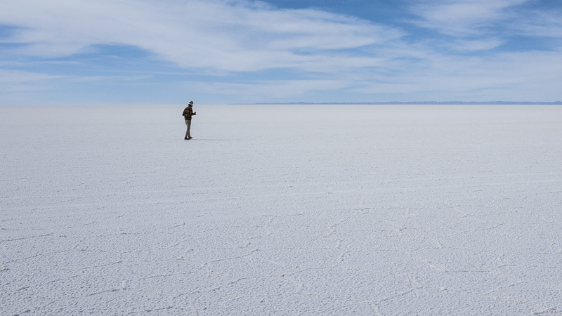 salt flat, land, beauty in nature, t, mineral, tranquil scene, lifestyles, real people, flats, outdoors, far, remote, scenics - nature, man, bolivium, standing