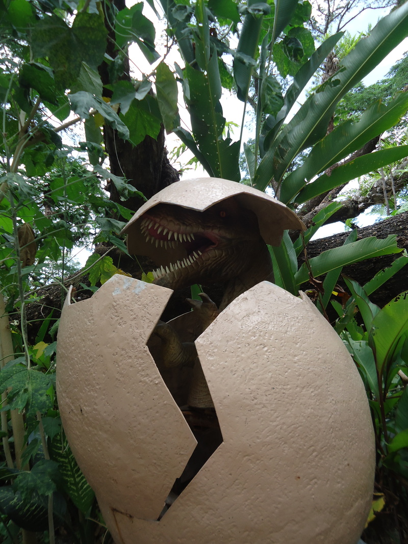 lizard, hatch, outdoors, green color, no people, vertebrate, prehistoric, leaf, dinosaur, jurassic, growth, art and craft, representation, plant, animal