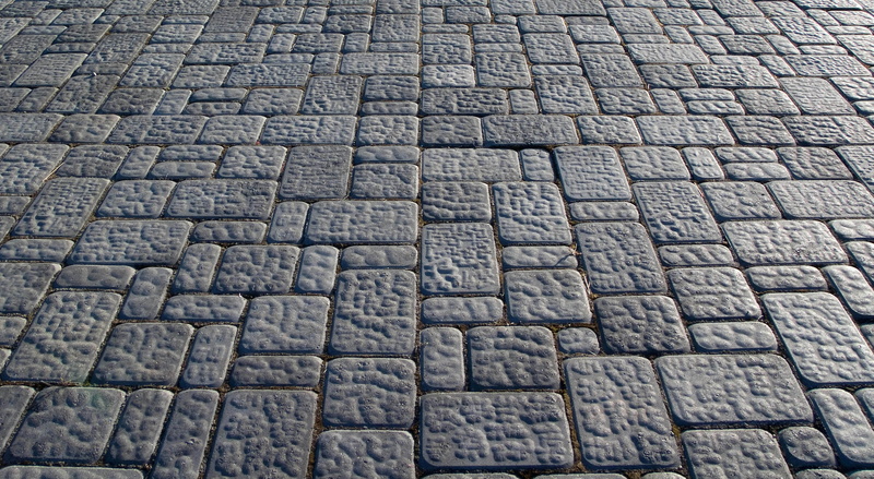 outdoors, in a row, concrete, repetition, full frame, solid, surface Level, material, macro, textured, cracked, dark, day, backgrounds, street, footpath