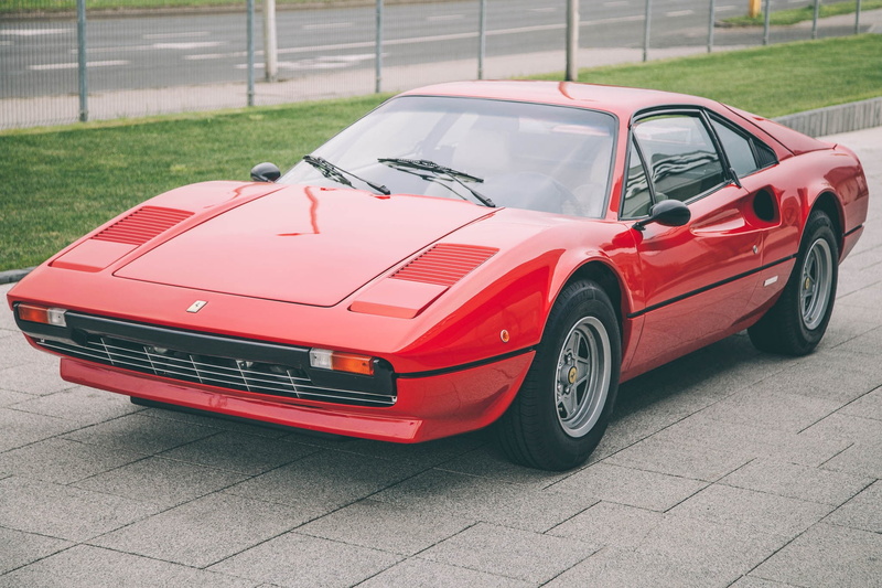 no people, mode of transportation, toy, vintage car, luxury, day, Ferrari, city, motor vehicle, retro styled, wheel, transportation, paving stone, land vehicle