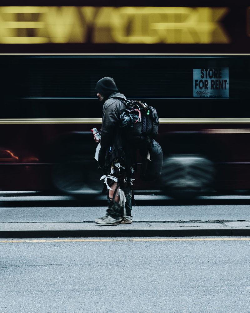 carrying, speed, street photography, uniform, train, bag, road, backpack, blurred motion, mode of transportation, rear view, motion, yellow, drink, person