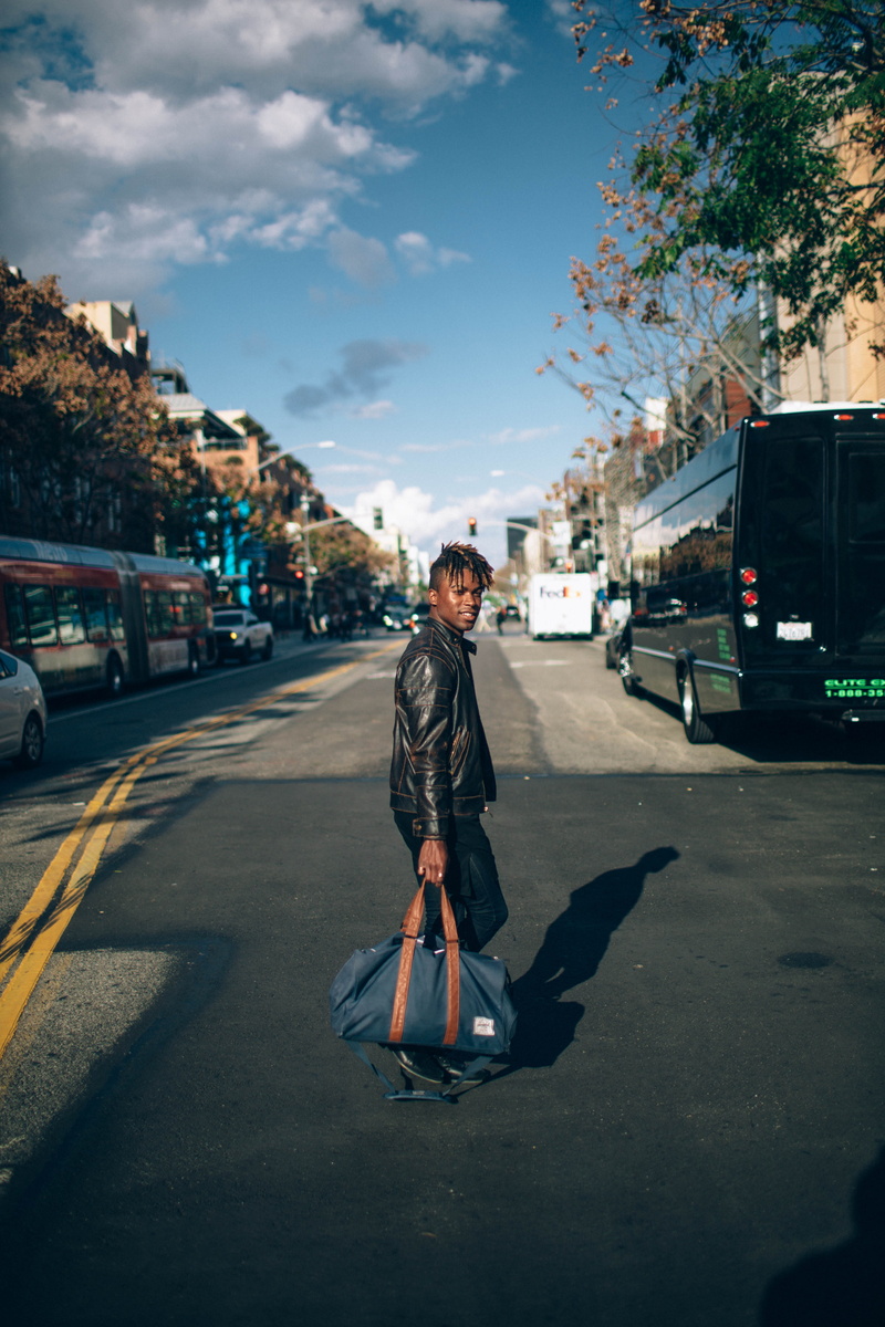 sky, casual clothing, road, real people, standing, architecture, day, crossing, lifestyles, person, crossing street, one person, outdoors, car, full length