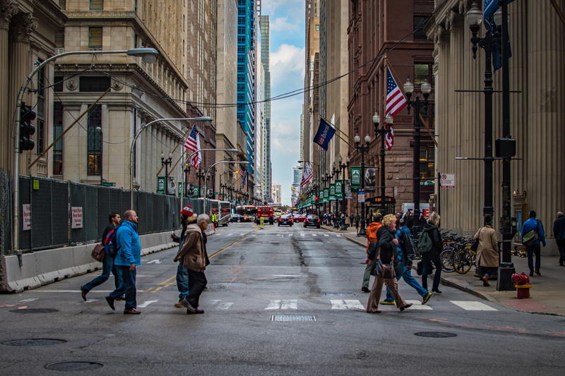 5K, intersection, lane, real people, group of people, building, land vehicle, city street, near, built structure, the way forward, day, direction, large group of people