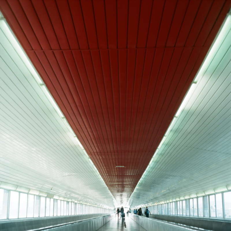 leaving, lighting equipment, minimalist, tunnel, walking, built structure, travel, ceiling, modern, mosaic, element, background, motion, flooring, image
