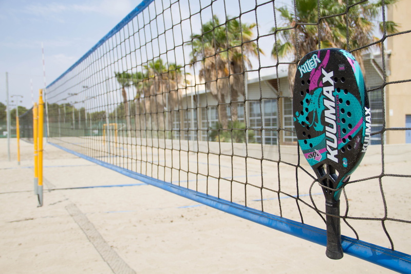 focus on foreground, nature, security, sports equipment, boundary, building exterior, no people, fence, beach tennis, sport, day, net - sports equipment