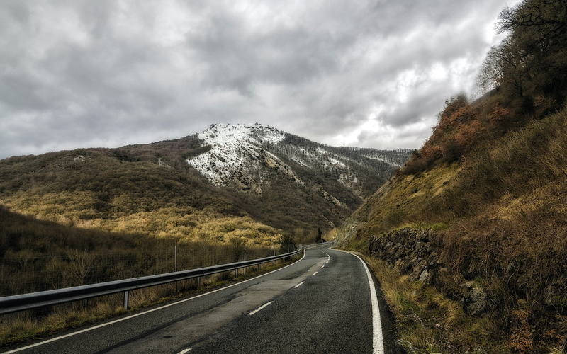 tranquil scene, non-urban scene, road marking, dividing line, scenics - nature, landscape, no people, snowcapped mountain, diminishing perspective, sign