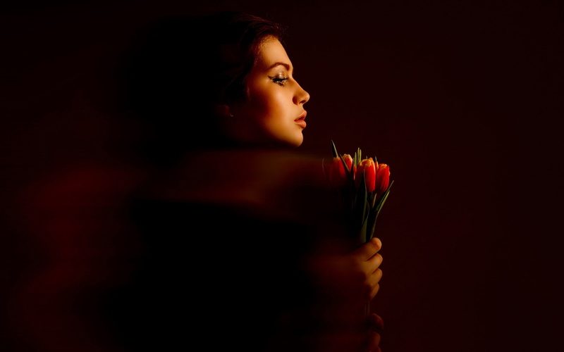 sadness, spirituality, indoors, flowering plant, bouquet, headshot, flower, studio shot, portrait, black background, one person, profile view, religion