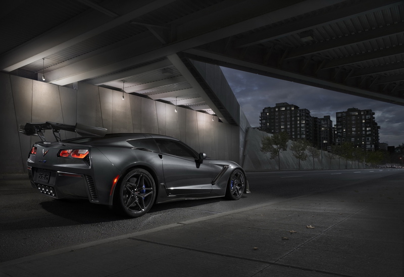 outdoors, night, motor vehicle, no people, city, nature, land vehicle, building, garage, built structure, building exterior, stationary, parking garage