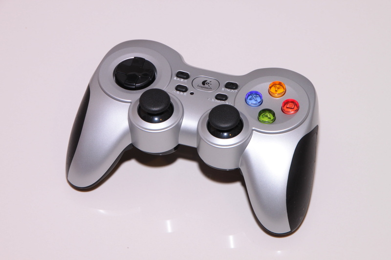 close-up, silver colored, technology, rumblepad, wireless, electrical equipment, single object, logitech, games, metal, electronics industry, control, gray