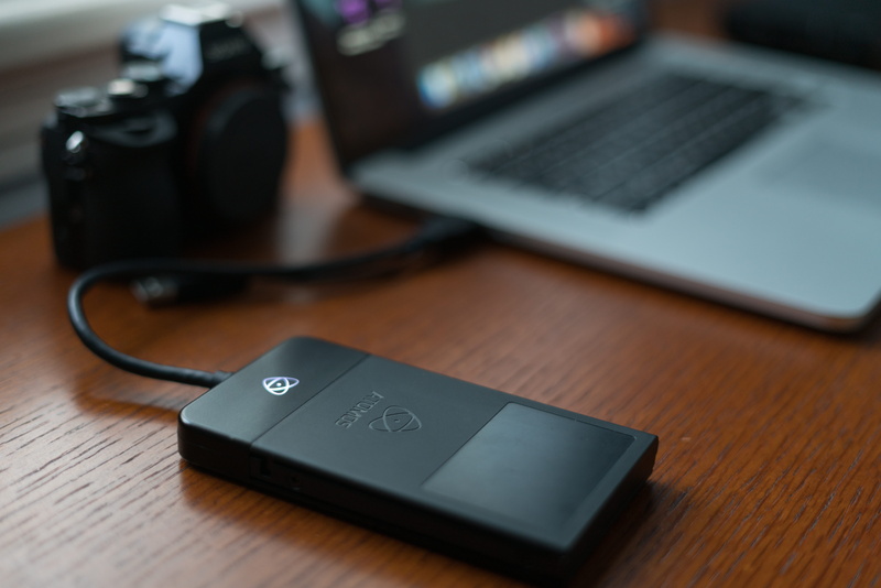 videographer, macbook, 8K, mobile phone, selective focus, filmmaking, table, sony, portability, wireless technology, no people, computer, still life, indoors
