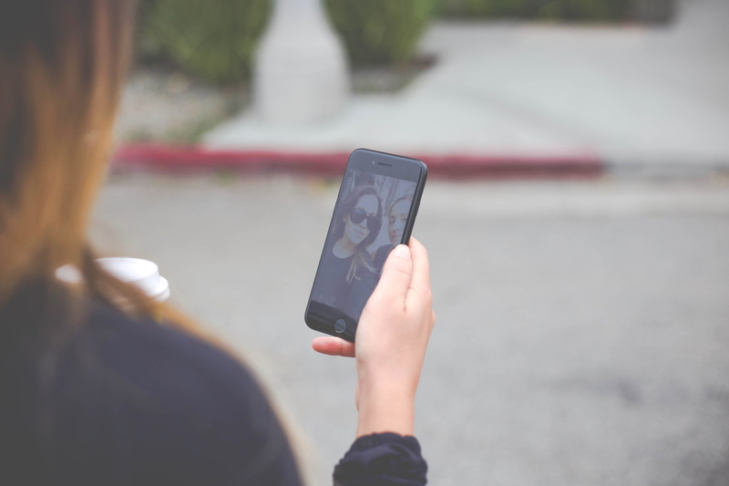 cell phone, ipod shuffle, smart phone, wireless technology, smartphone, city, human, leisure activity, human hand, real people, selfie, los angeles, one person