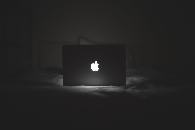 black background, dark, front view, computer, 5K, single object, copy space, candle, indoors, macbook, notebook, studio shot, illuminated, late, domestic room