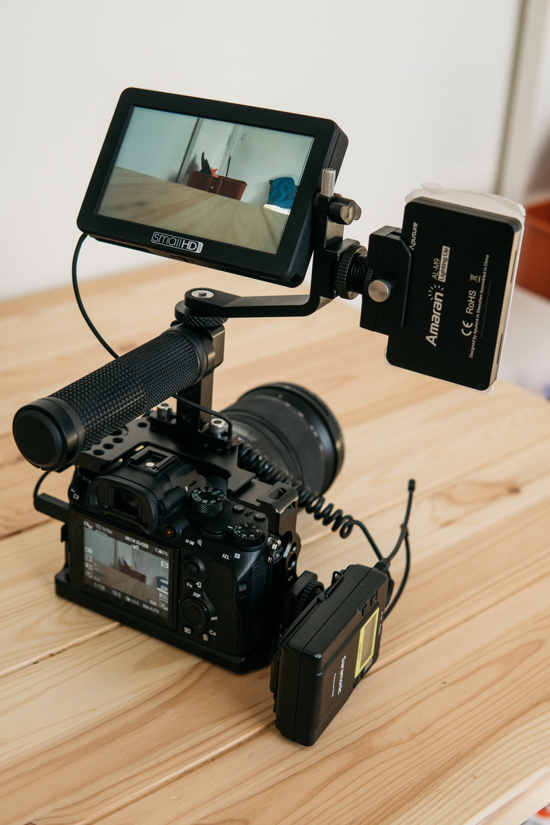 digital camera, tech, wood, no people, still life, hardwood floor, camera - photographic equipment, setup, black color, electronics, monitor, audio, table