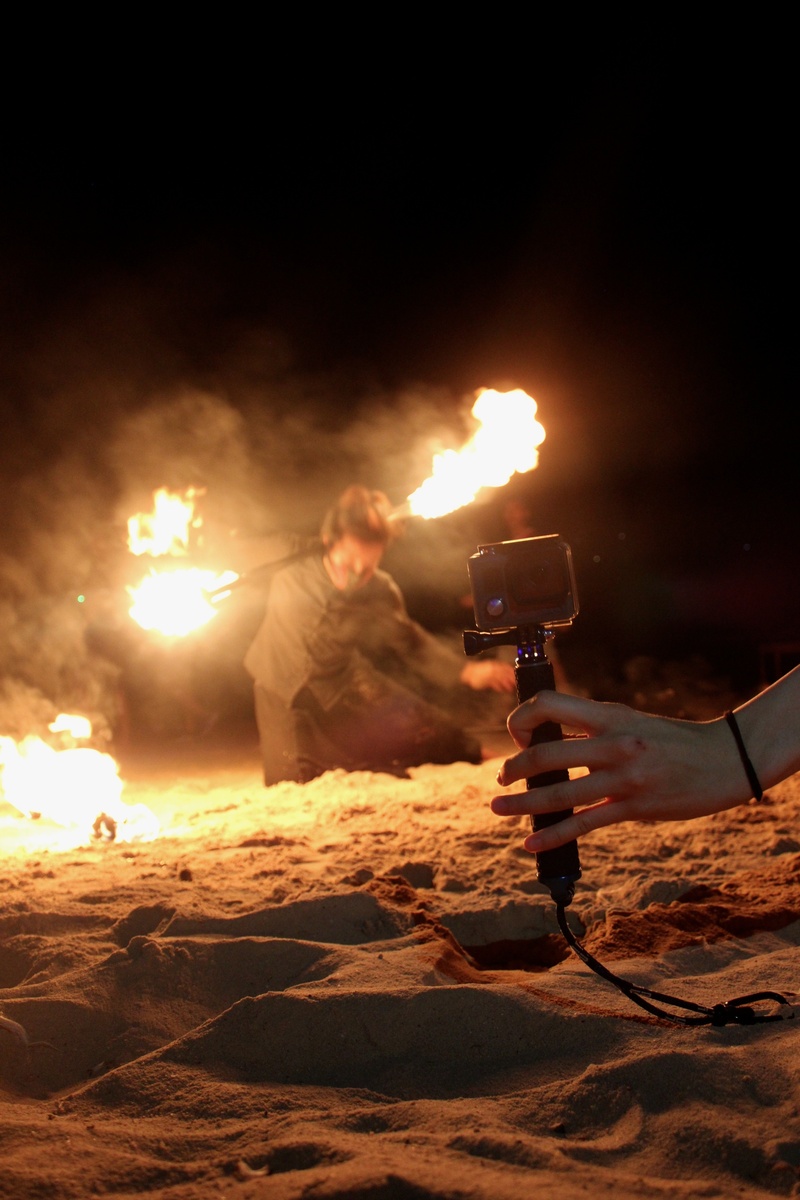 holding, photographing, land, wireless technology, fire, heat - temperature, fire-show, thailand, real people, men, filming, technology, outdoors, communication
