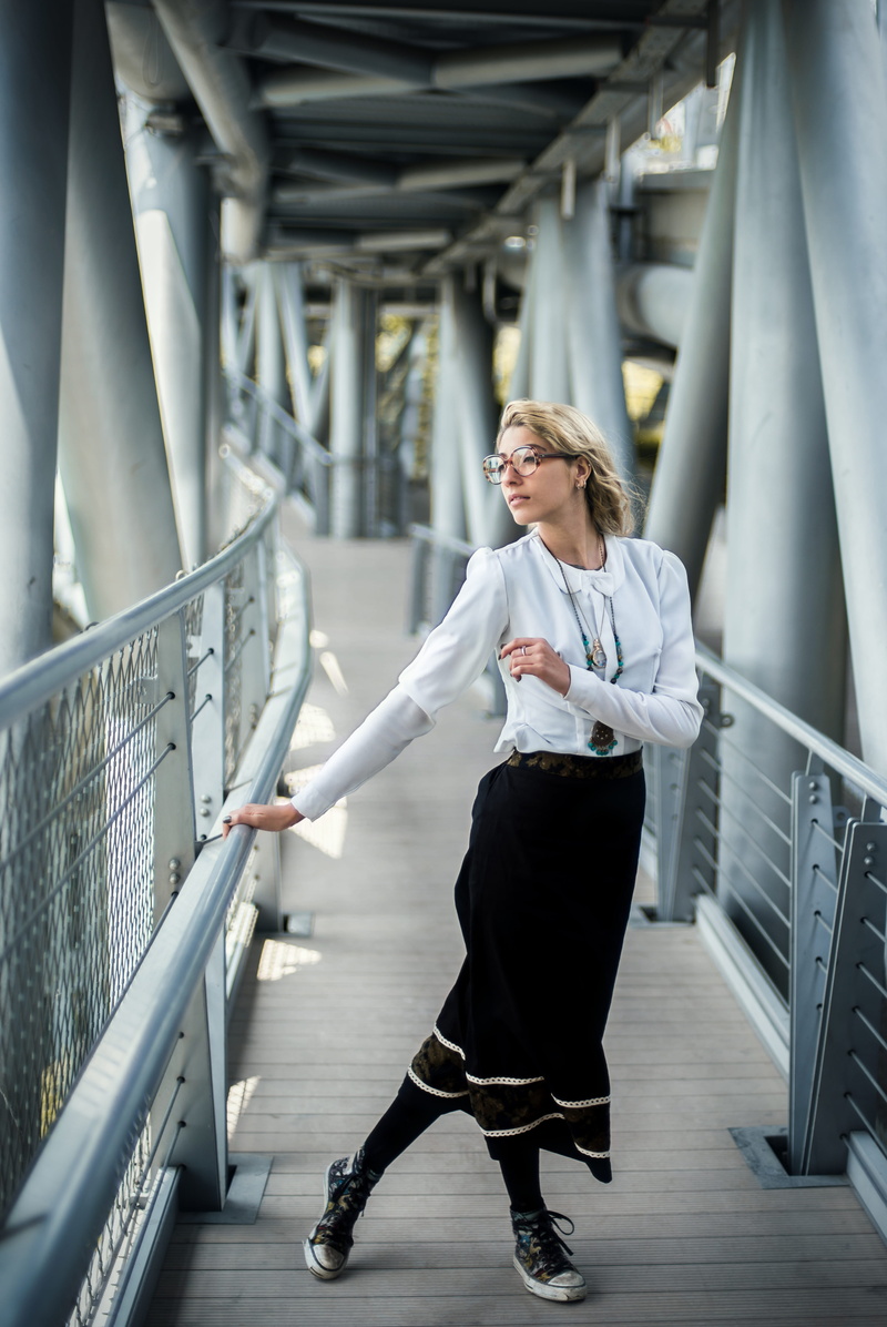 person, adult, front view, shoe, standing, hairstyle, handrail, sleeve, high heel, corridor, machine, connection, full length, young women, wearing, holding