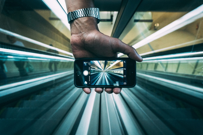 station, indoors, transportation, tube, one person, architecture, adult, empty, smartphone, journey, iphone, travel, mobile phone, escalators, holding