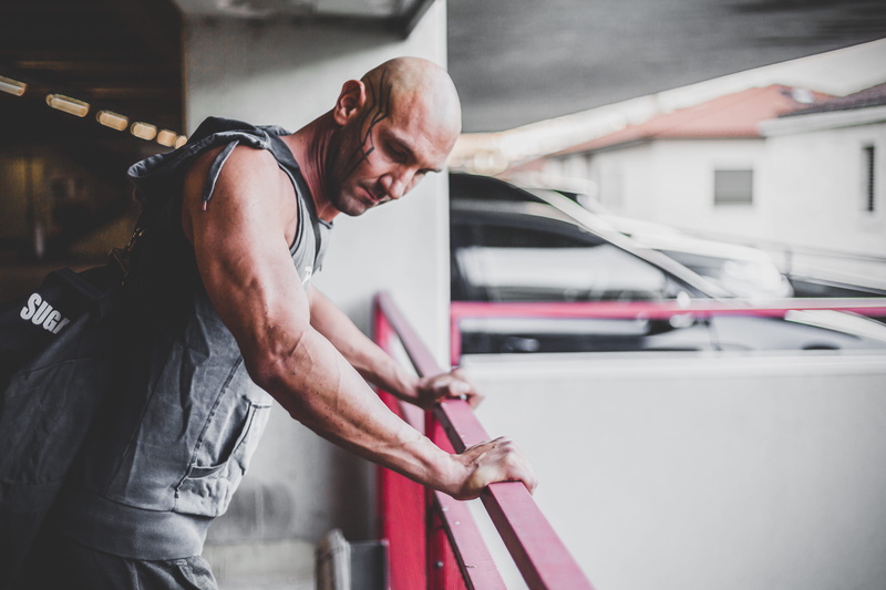 industry, hand, person, red, vehicle, lot, 5K, holding, man, real people, transportation system, males, day, human body part, one person, men, indoors
