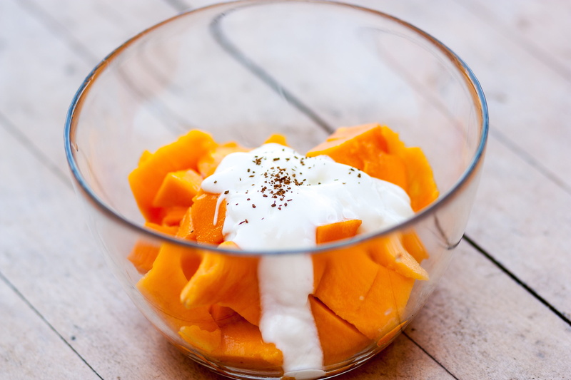cream, orange color, wood - material, custard, egg yolk, table, indoors, wellbeing, ingredients, papaya, fruit, clear, yoghurt, focus on foreground, slice