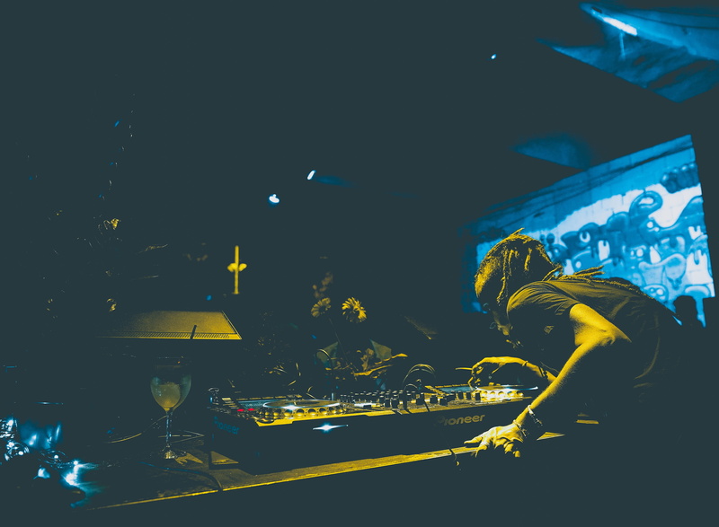 built structure, terminal, real people, club, enjoyment, festival, popular music concert, dj, one person, man, stage, performance, nightclub, yellow, party