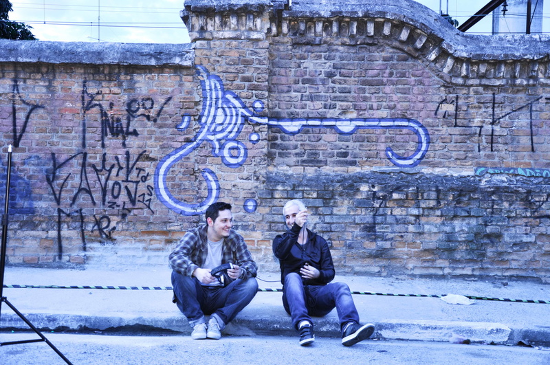 music, positive emotion, wall, real people, young men, sitting, musican, city, couple - relationship, architecture, adult, people, young women, graffiti
