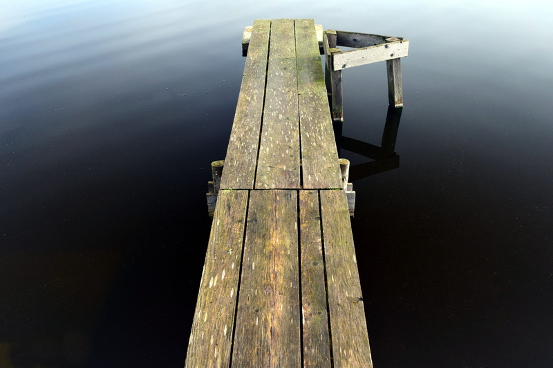 wooden post, architecture, wood, pond, quiet, damaged, boardwalk, single object, lonely, reflection, nature, wood - material, away, high angle view, water
