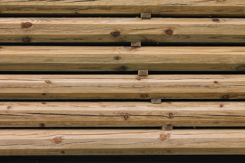 repetition, outdoors, built structure, in a row, pile, timber, plank, day, architecture, wood, material, stack, rough, stacked, large group of objects