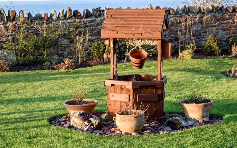 wood - material, plant, outdoors, wishing, wish, pots, potted plant, landscape, land, green color, no people, garden, well, field, daytime, non-urban scene