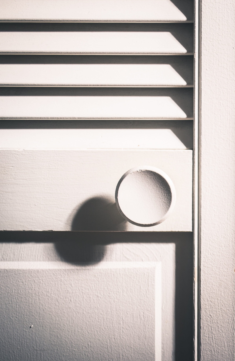 design, full frame, doorknob, sunlight, geometric shape, close-up, wood, day, metal, 2K, window, wood - material, shape, alloy, focus on shadow, handle