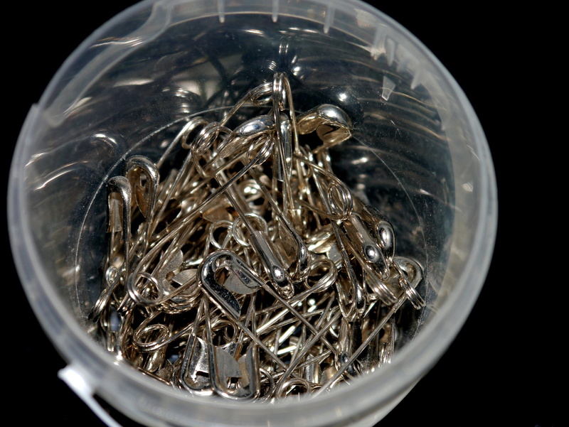 black background, high angle view, indoors, silver, still life, bowl, 4K, container, safety pin, transparent, glass - material, sew, directly above, selective focus