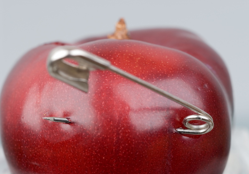food and drink, safety pin, healthy eating, red, food, freshness, fruit, apple - fruit, security, water, studio shot, wellbeing, selective focus, no people
