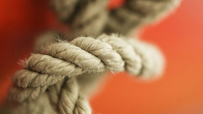 warm clothing, fastener, human hand, selective focus, front view, skill, studio shot, textile, hand, abstract, strength, one person, knot, 1080P, focus on foreground