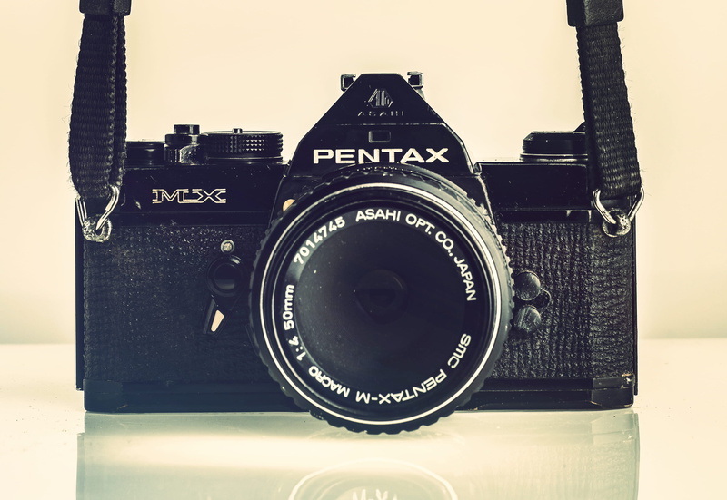 single object, camera - photographic equipment, close-up, shutter, indoors, negative, nostalgia, antique, text, front, digital camera, no people, number