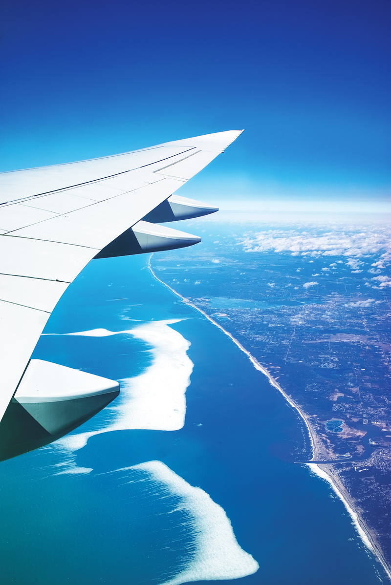 stratosphere, airplane, travel, looking Through Window, environment, city, horizon, seashore, air, wing, high Angle View, ocean, blue, urban Skyline, water