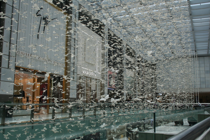 butterfly decoration, mall, mode of transportation, raindrop, window, day, built structure, glass - material, rainy season, fashion avenue, shops, architecture