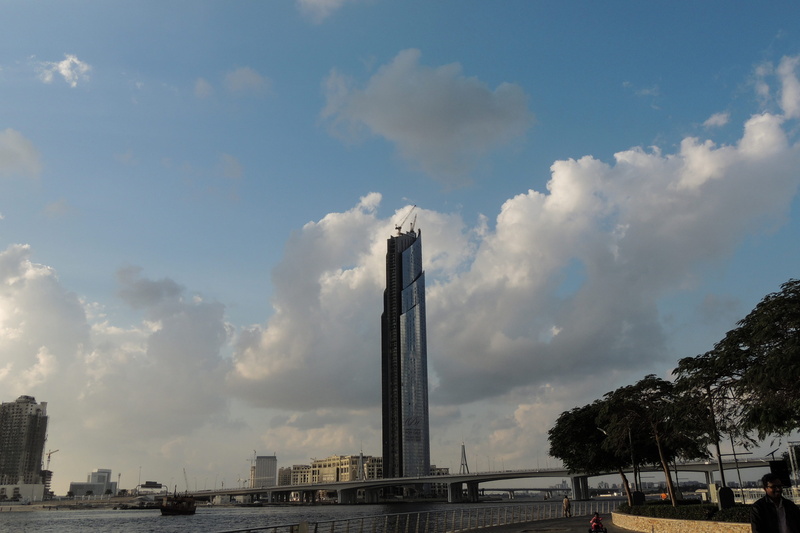 fastival mall, sunny day, office building exterior, city, tower, pollution, architecture, skyscraper, outdoors, memorial, smoke stack, tourism, tall - high