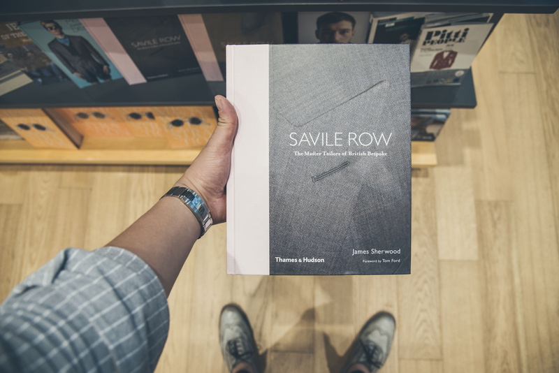 bookstore, wood - material, finger, happ, men, savile raw, text, human hand, shoe, table, high angle view, communication, personal perspective, china, dubai mall
