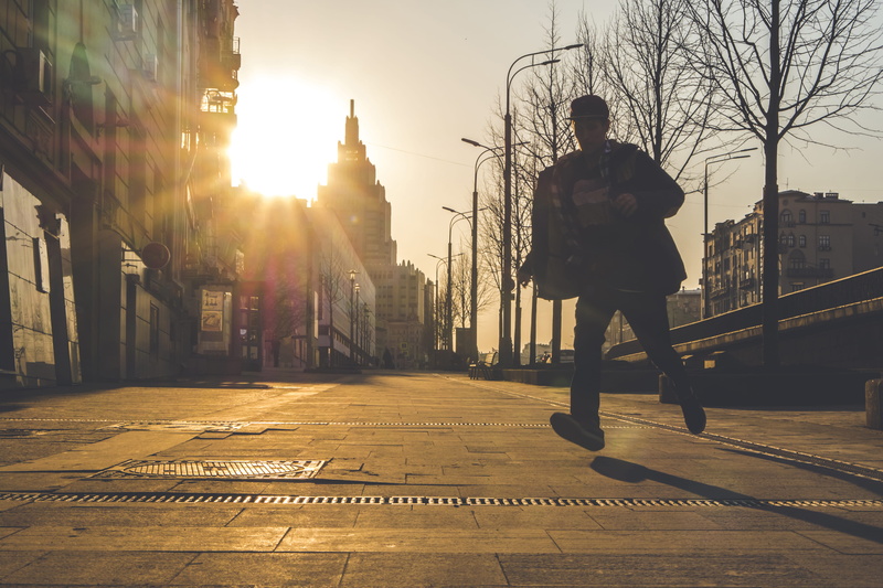 man, one person, nature, motion, bridge, built structure, action, building exterior, sunset, lifestyles, evening, city life, sky, full length, legs, direction